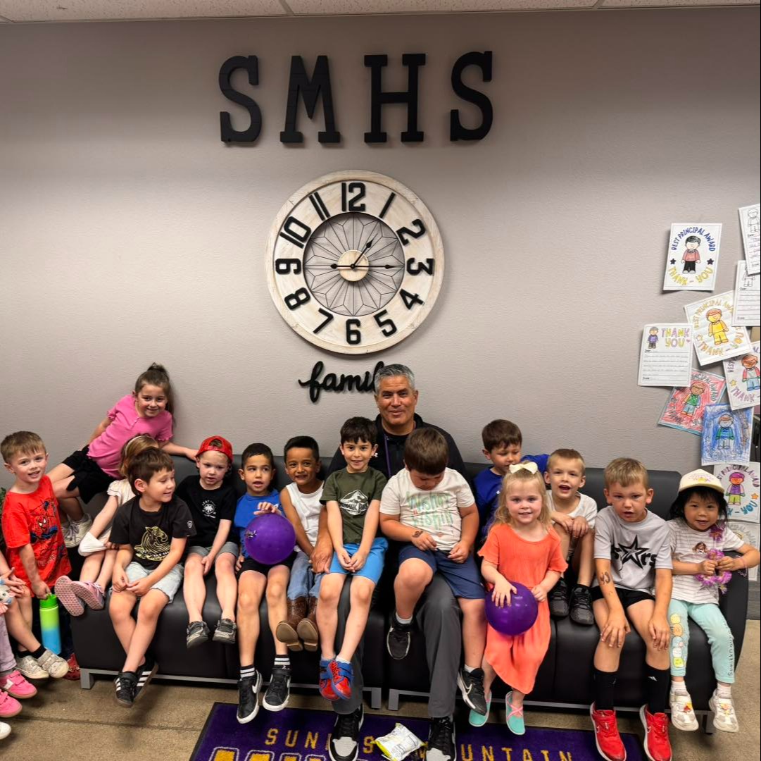 School principal with students from COOP