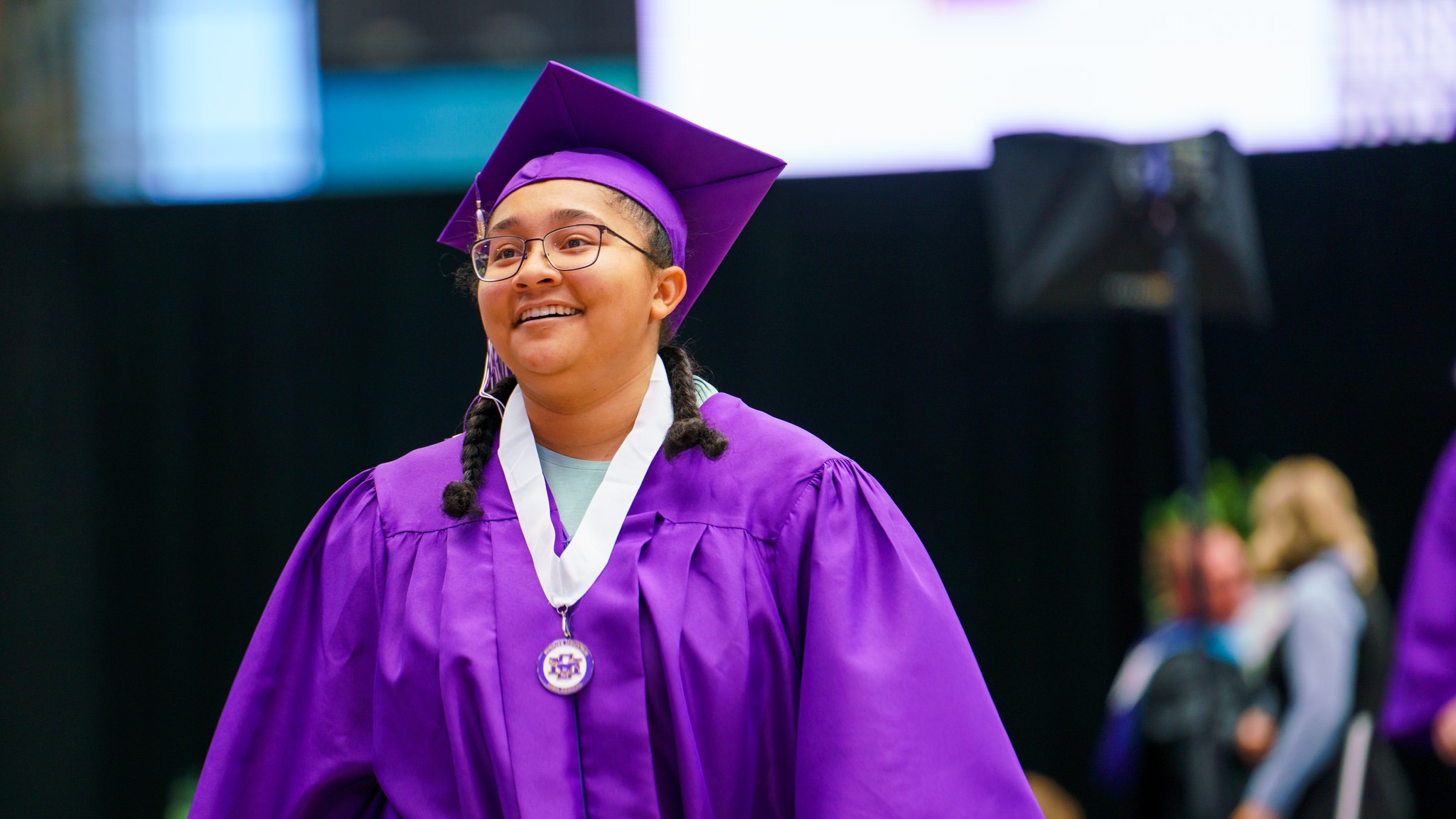 Student smiling after walking across the stage