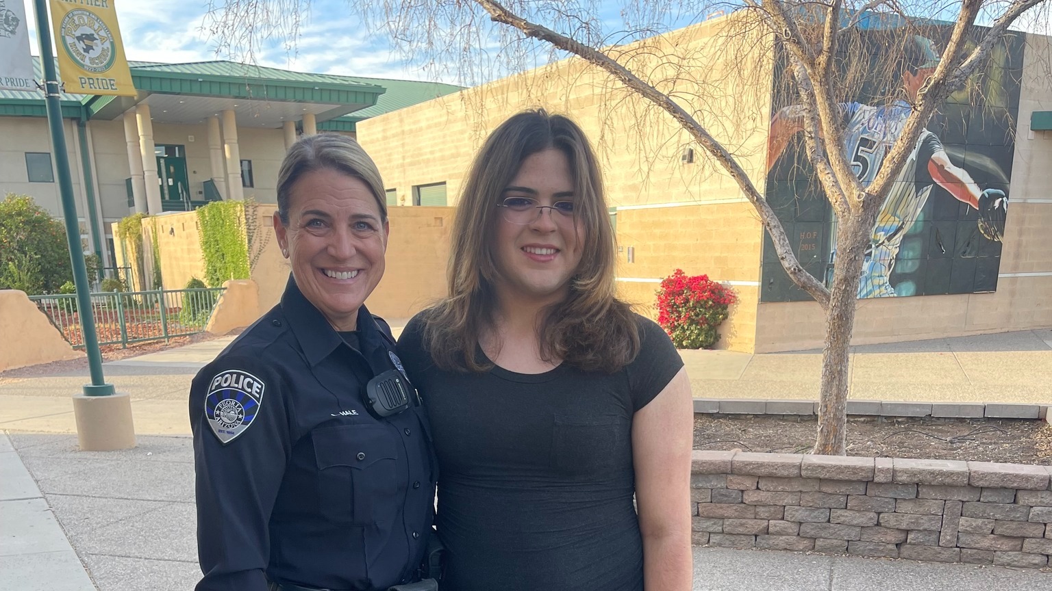 Officer Hale posing with a student
