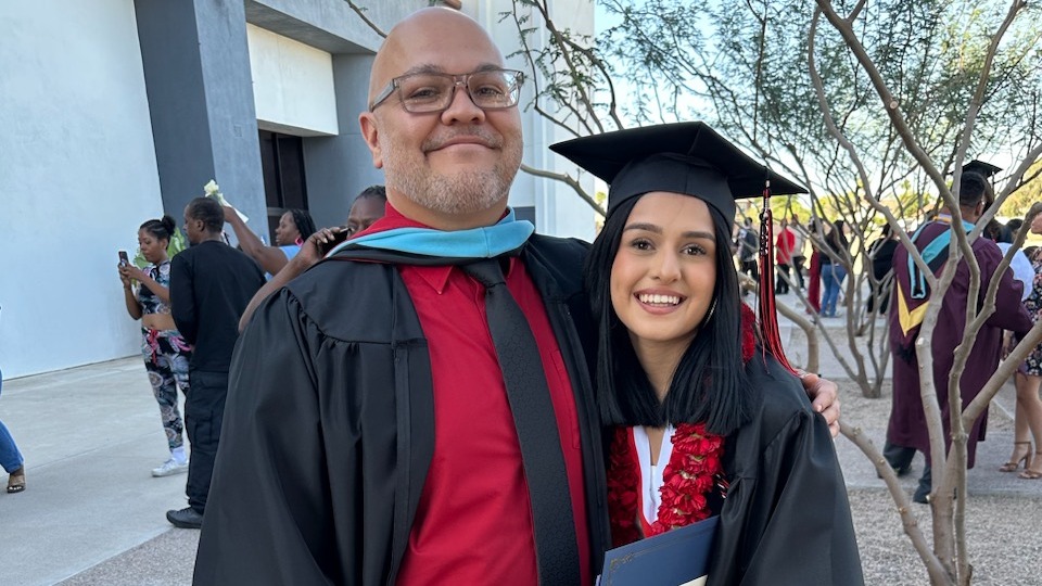 Student and teacher at graduation