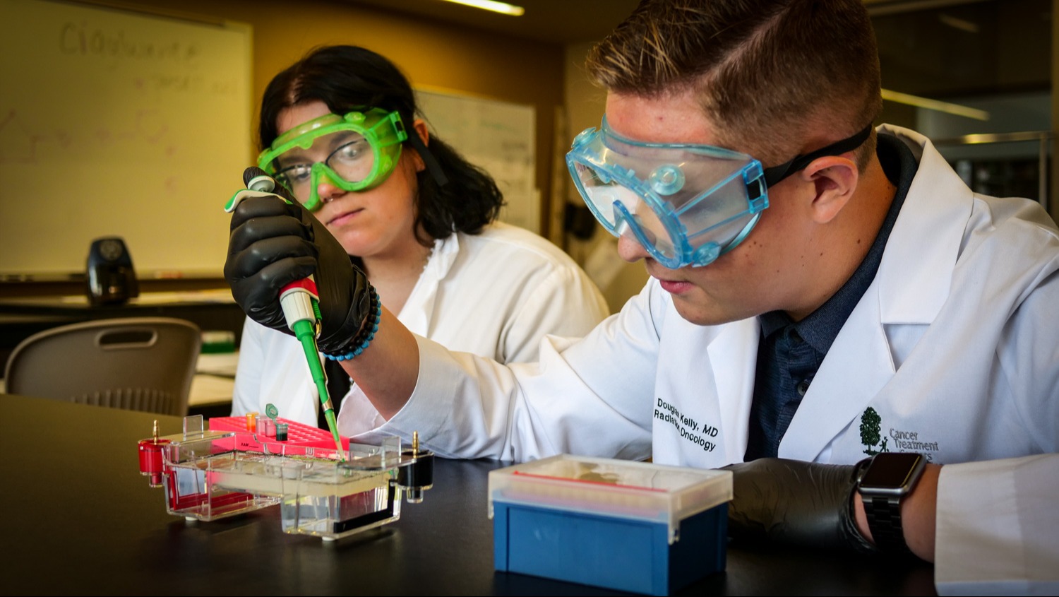 Students practicing pipetting techniques