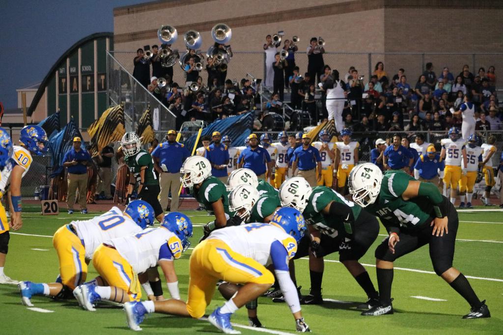 A football team competes in a match, showcasing teamwork and athleticism on the field.