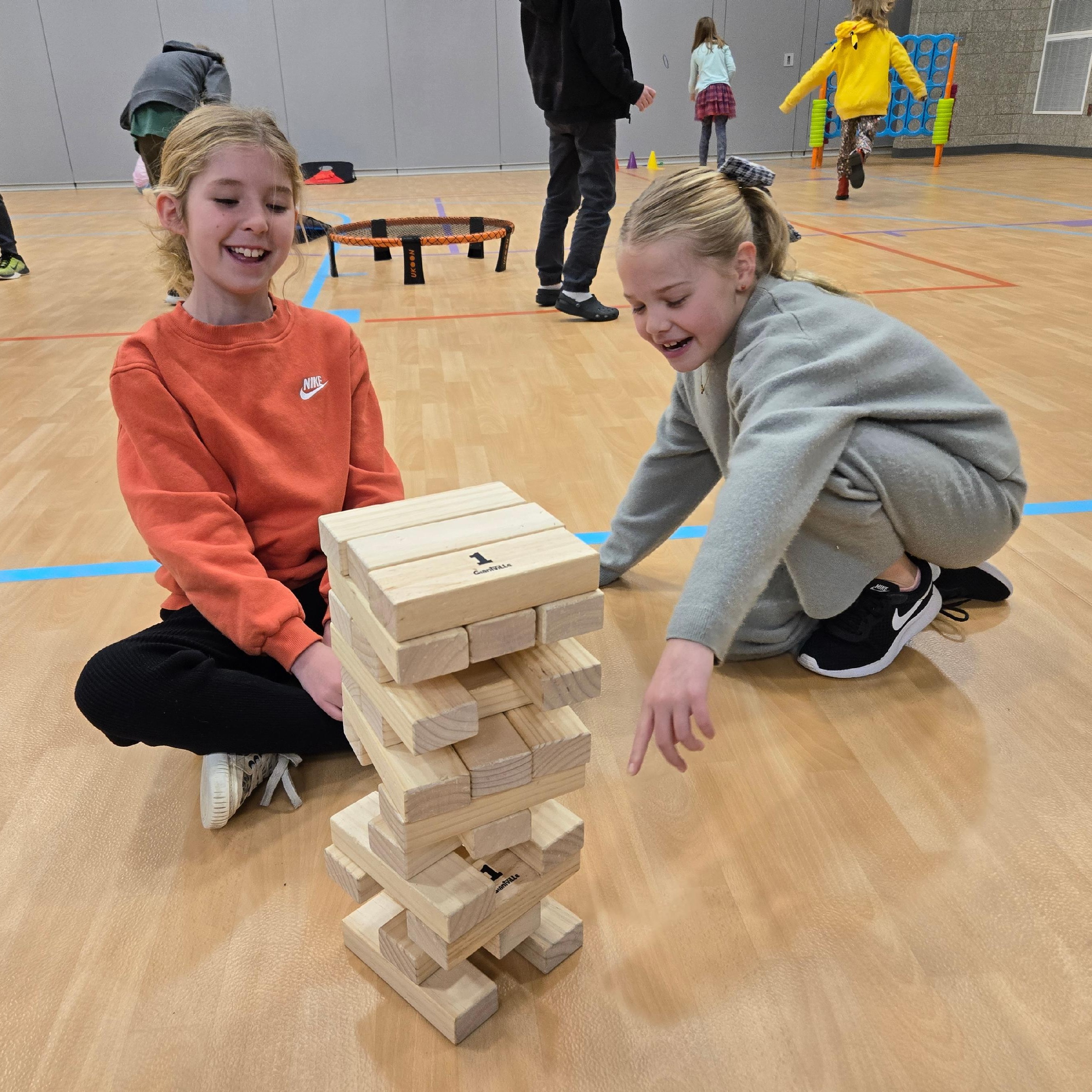 Two students playing Jenga
