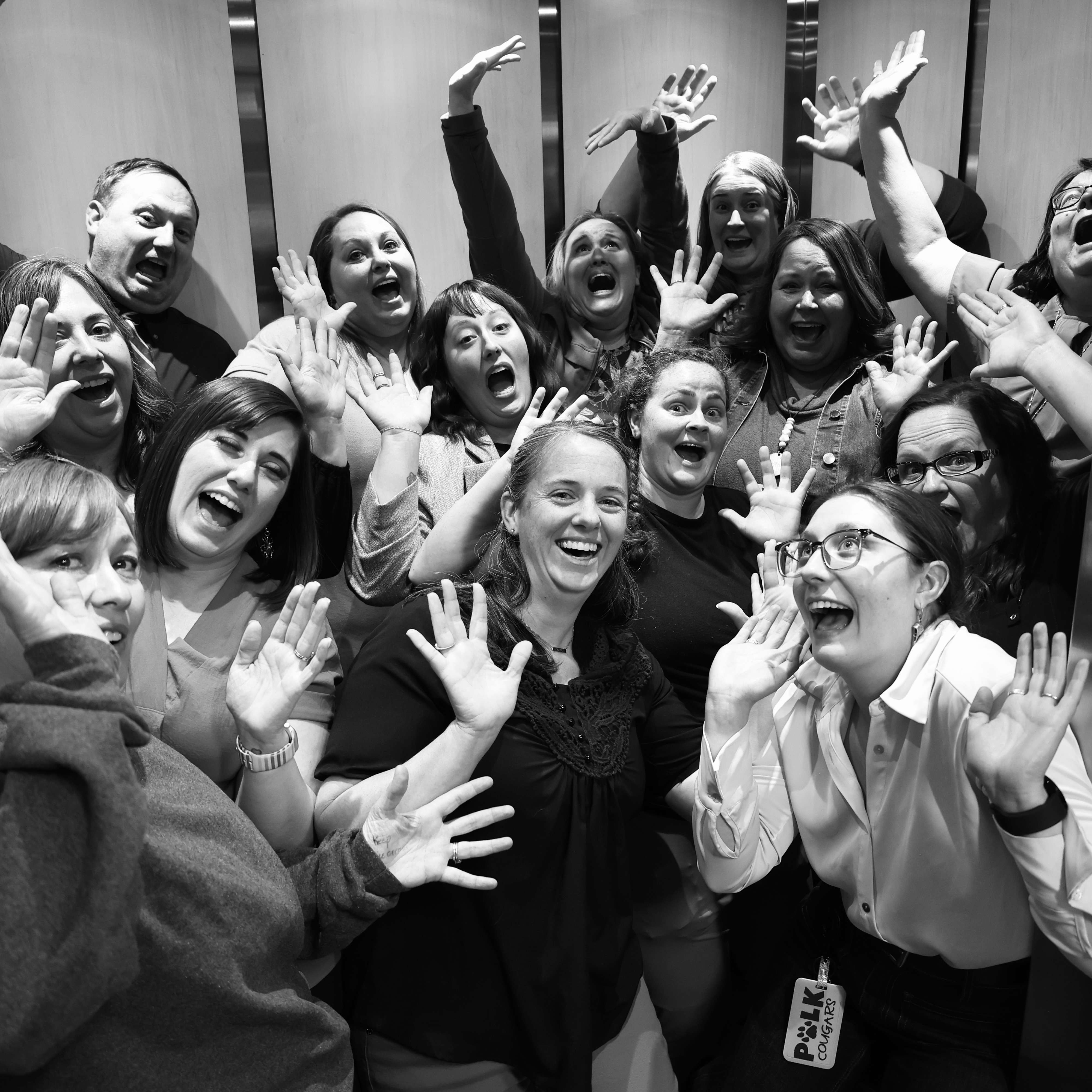 Polk staff members crammed inside the elevator