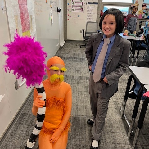 Two students dressed up in funny costumes