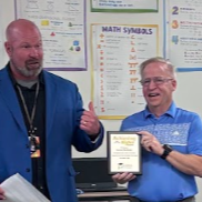 Merkley Getting the Achieving Higher Award on 11/20/25