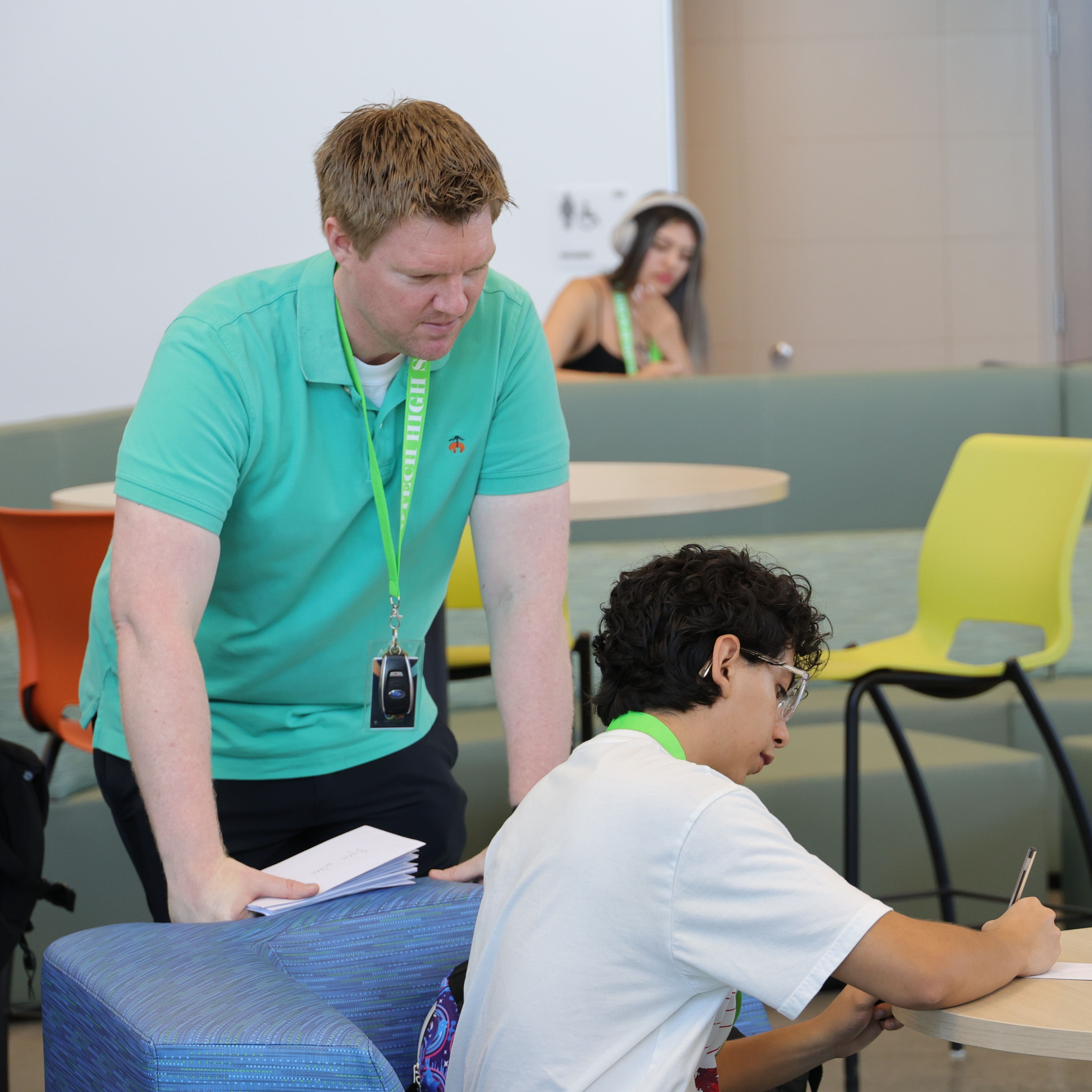 Mr. Gal helping student