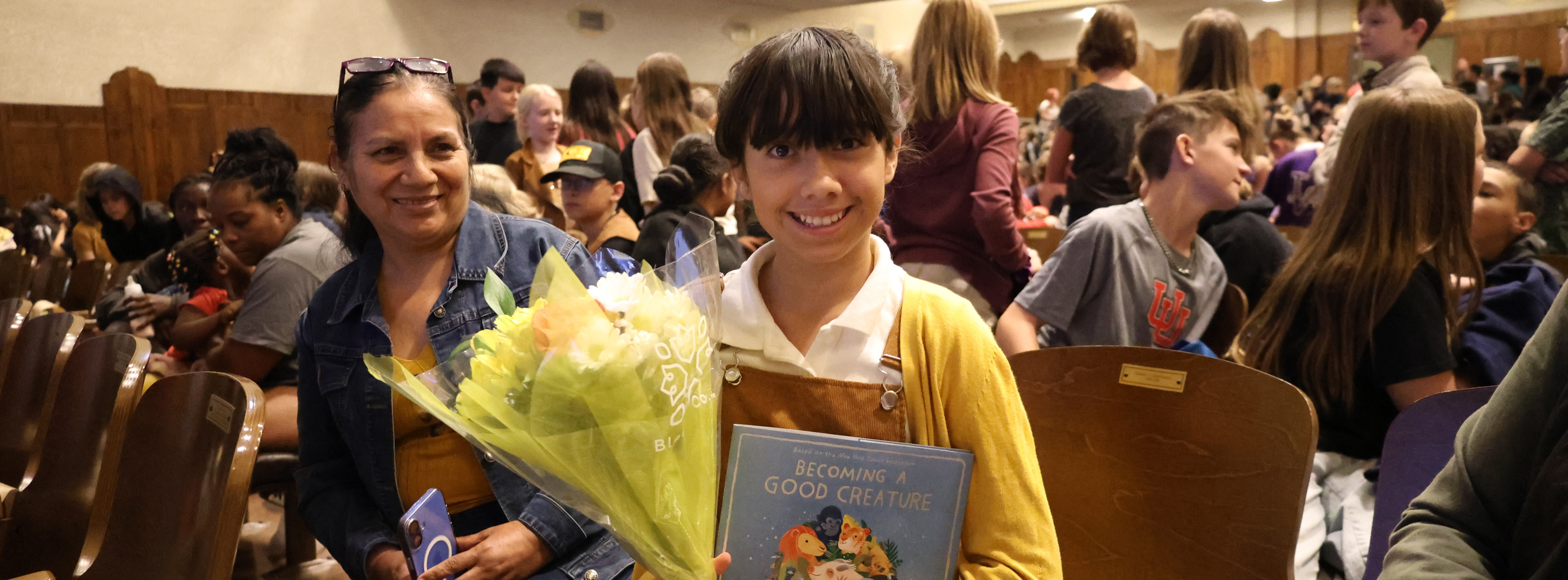 student holding book