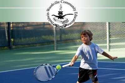 Cover of Badwin-Woodville Community Education catalog showing a boy playing tennis.