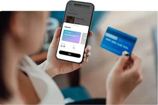 Icon of  woman paying through her cell phone.