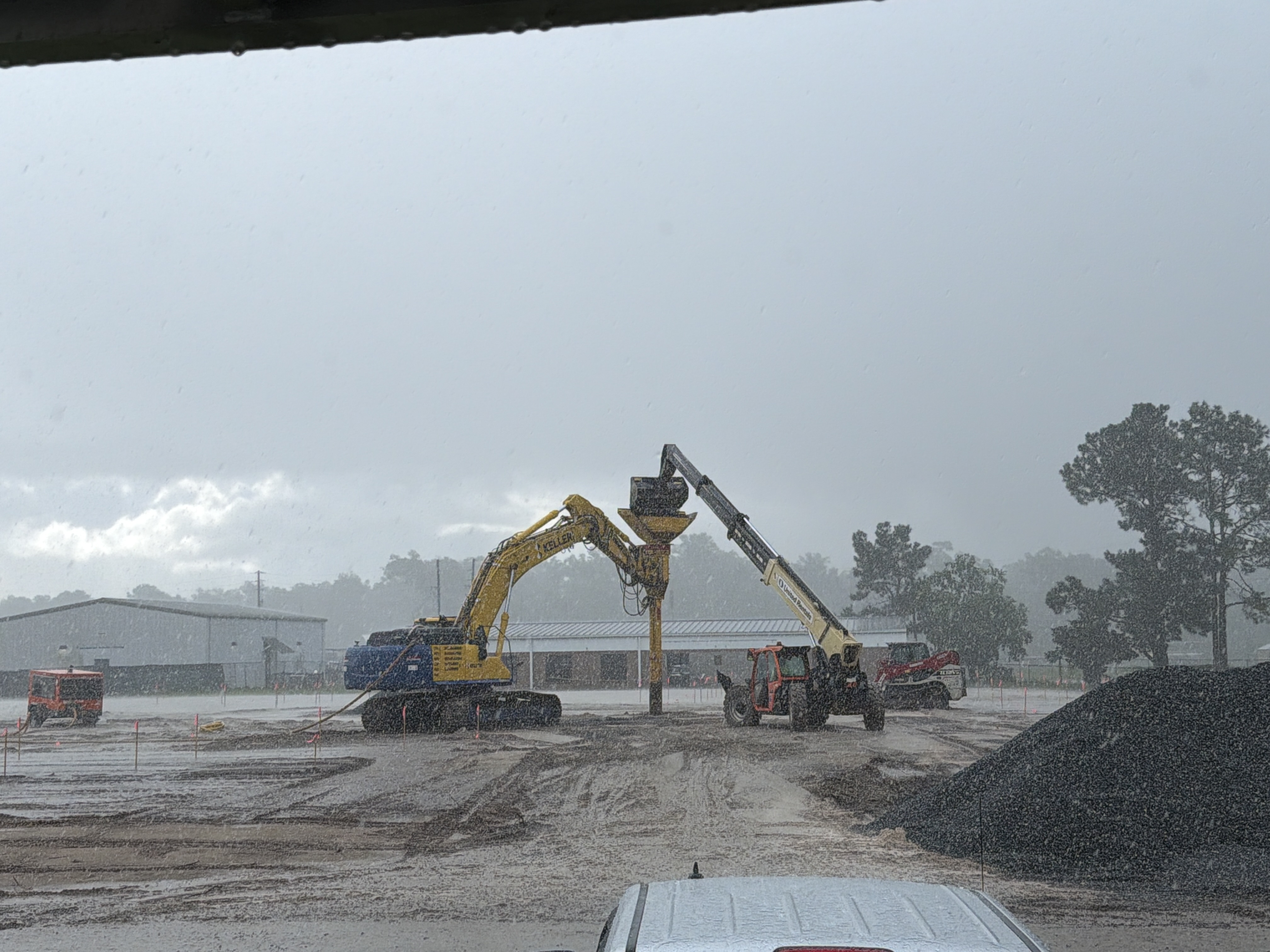 Rammed aggregate piers being added to gym foundation