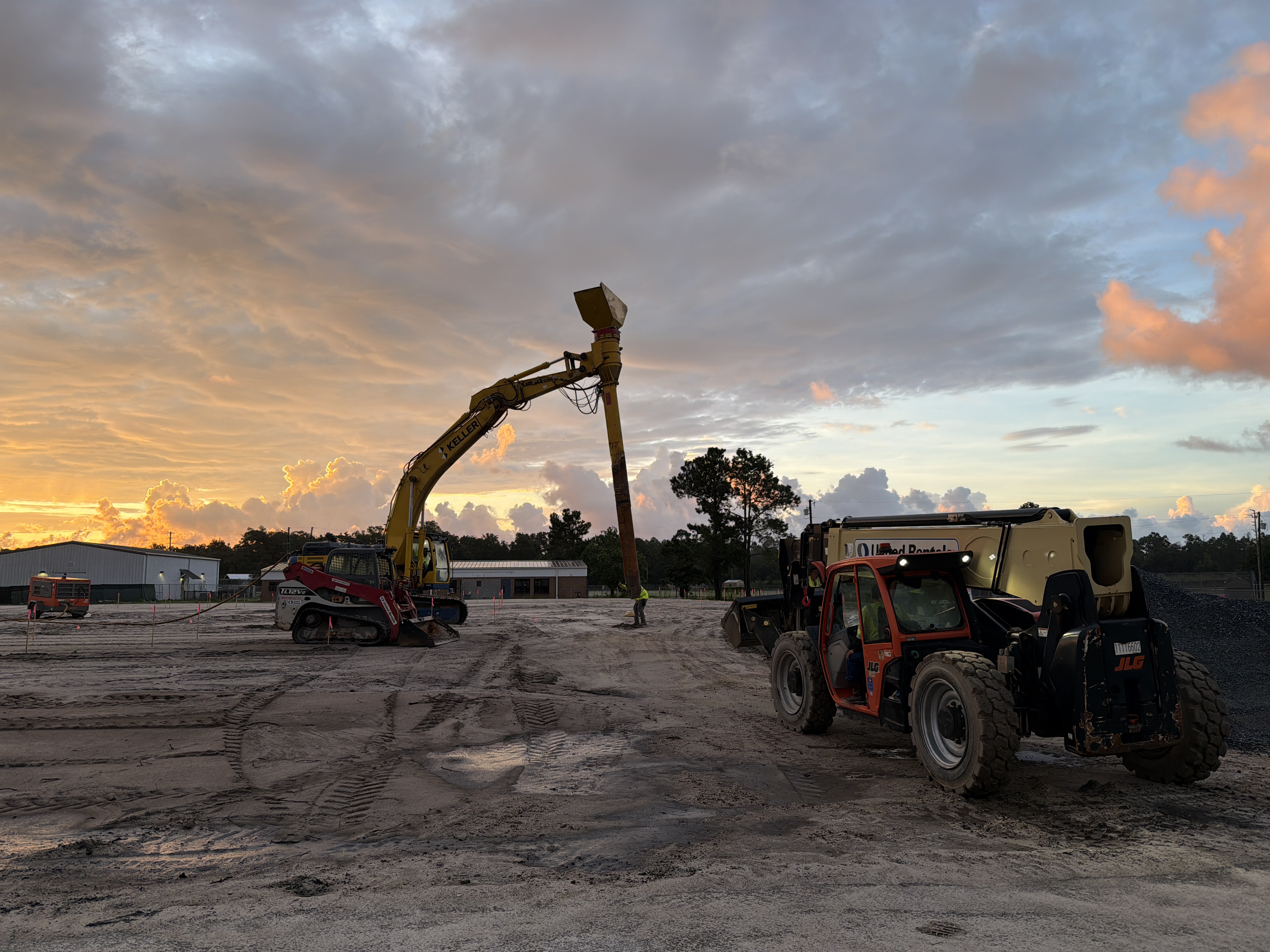 Rammed aggregate piers being added to gym foundation