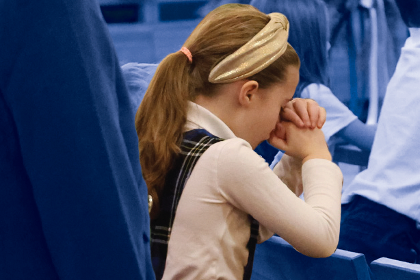 student praying