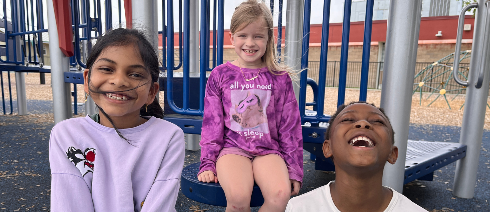 Three students on the Forest North playground