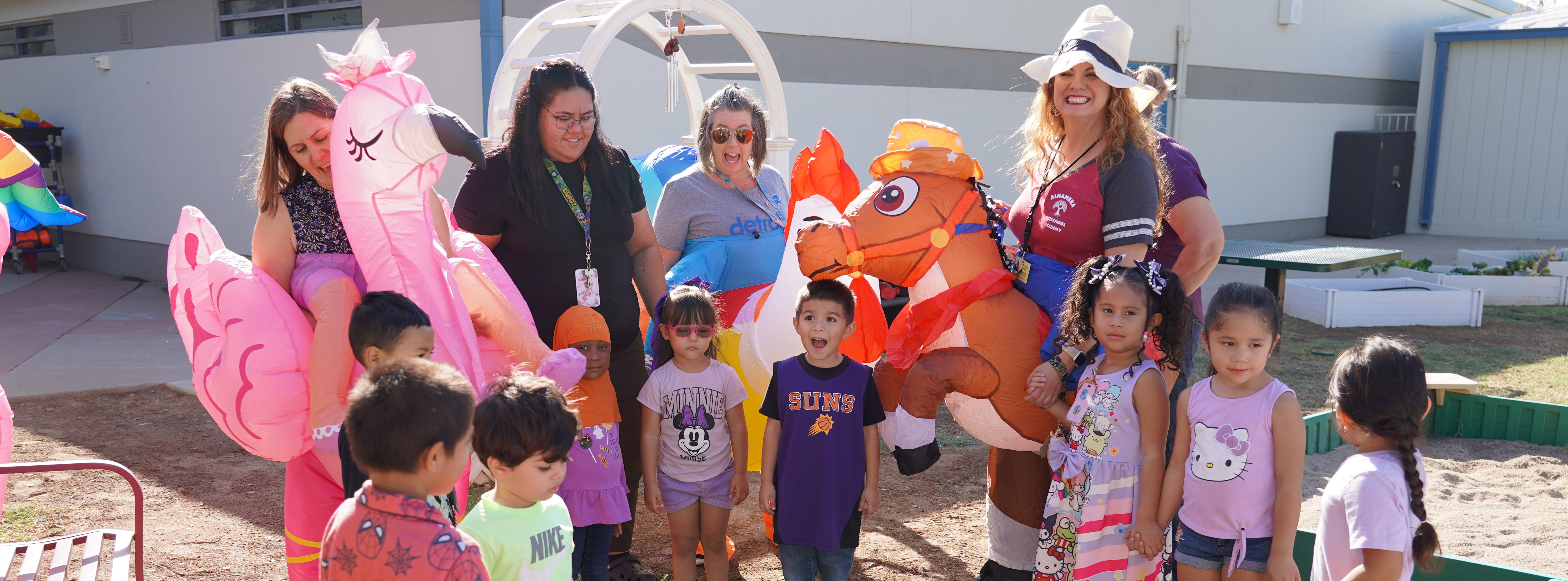 Students and Staff in blow up customs