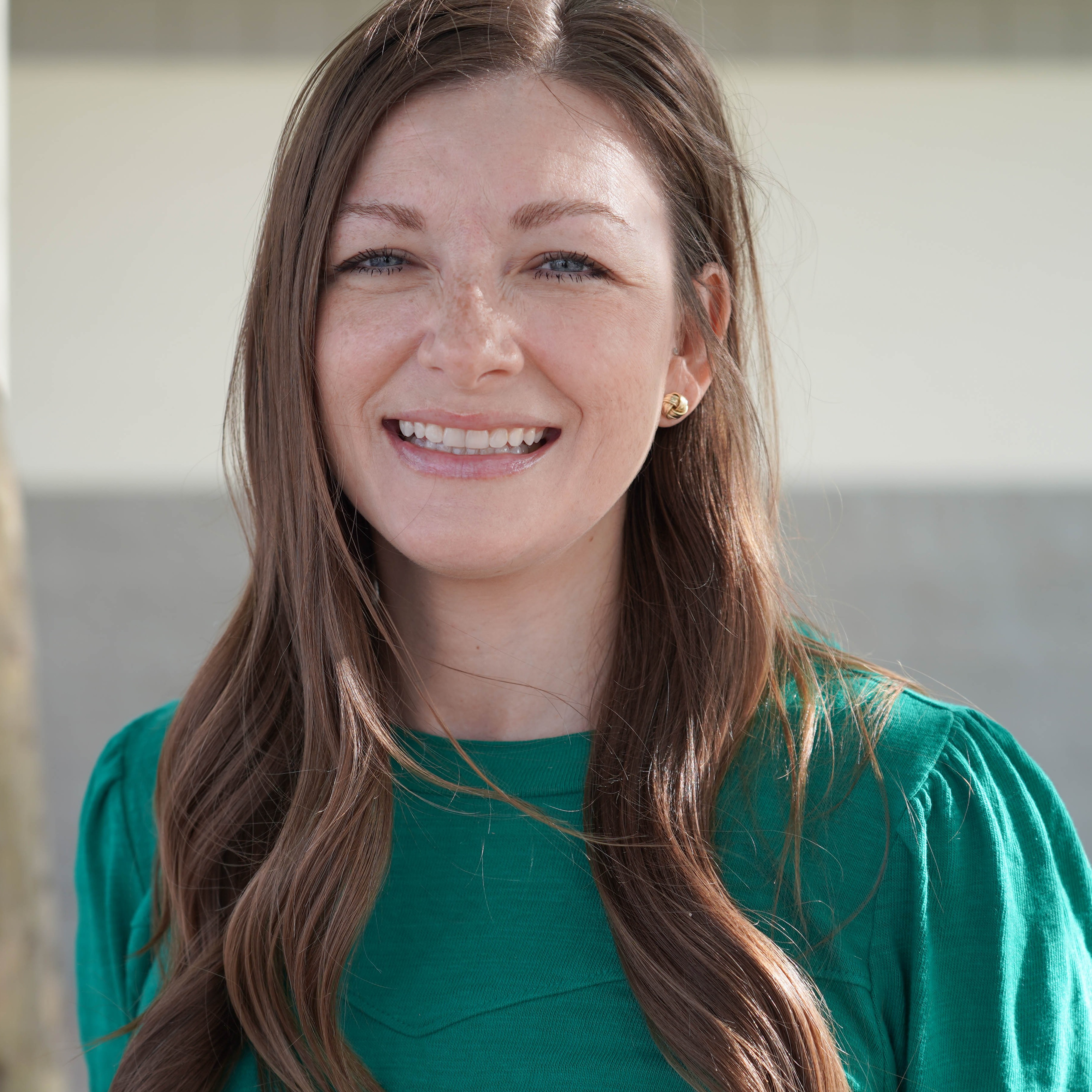 Smiling woman in green top