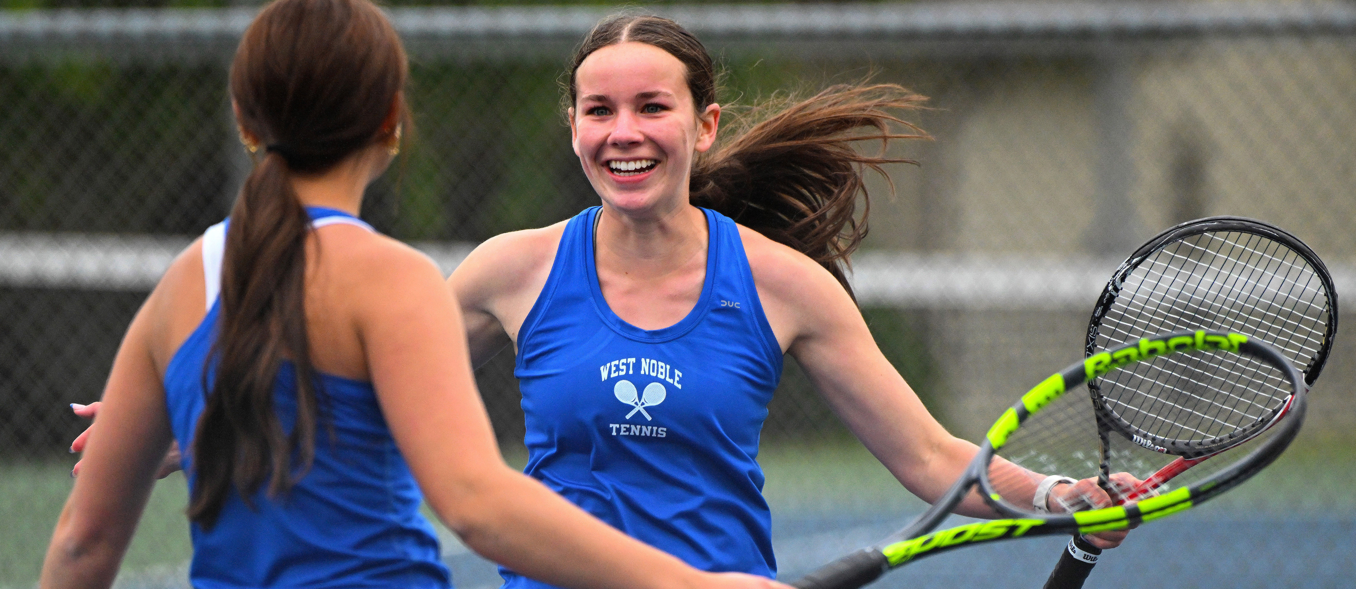 girls celebrating at tennis