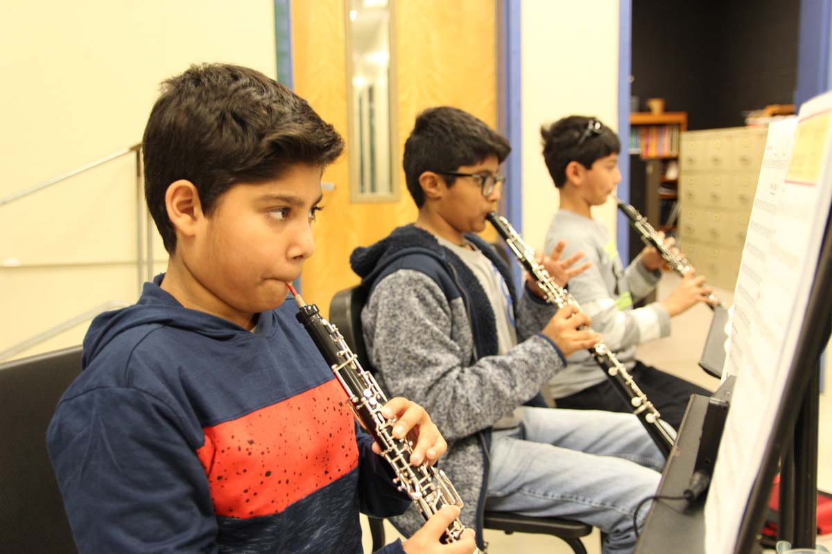 Band students practiciting instruments.