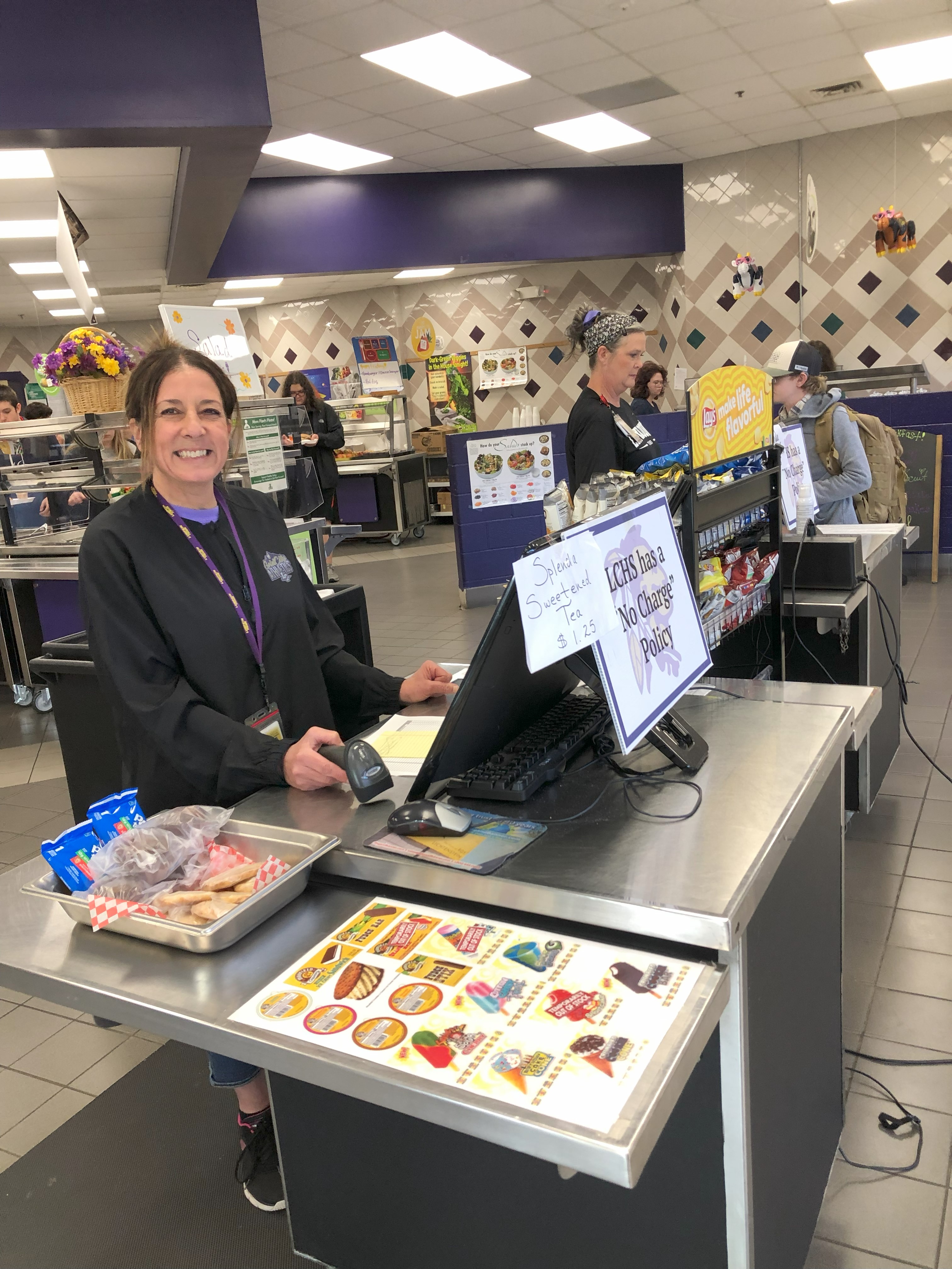 Smiling staffer at LCHS cash register!
