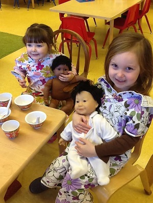 Children playing with dolls
