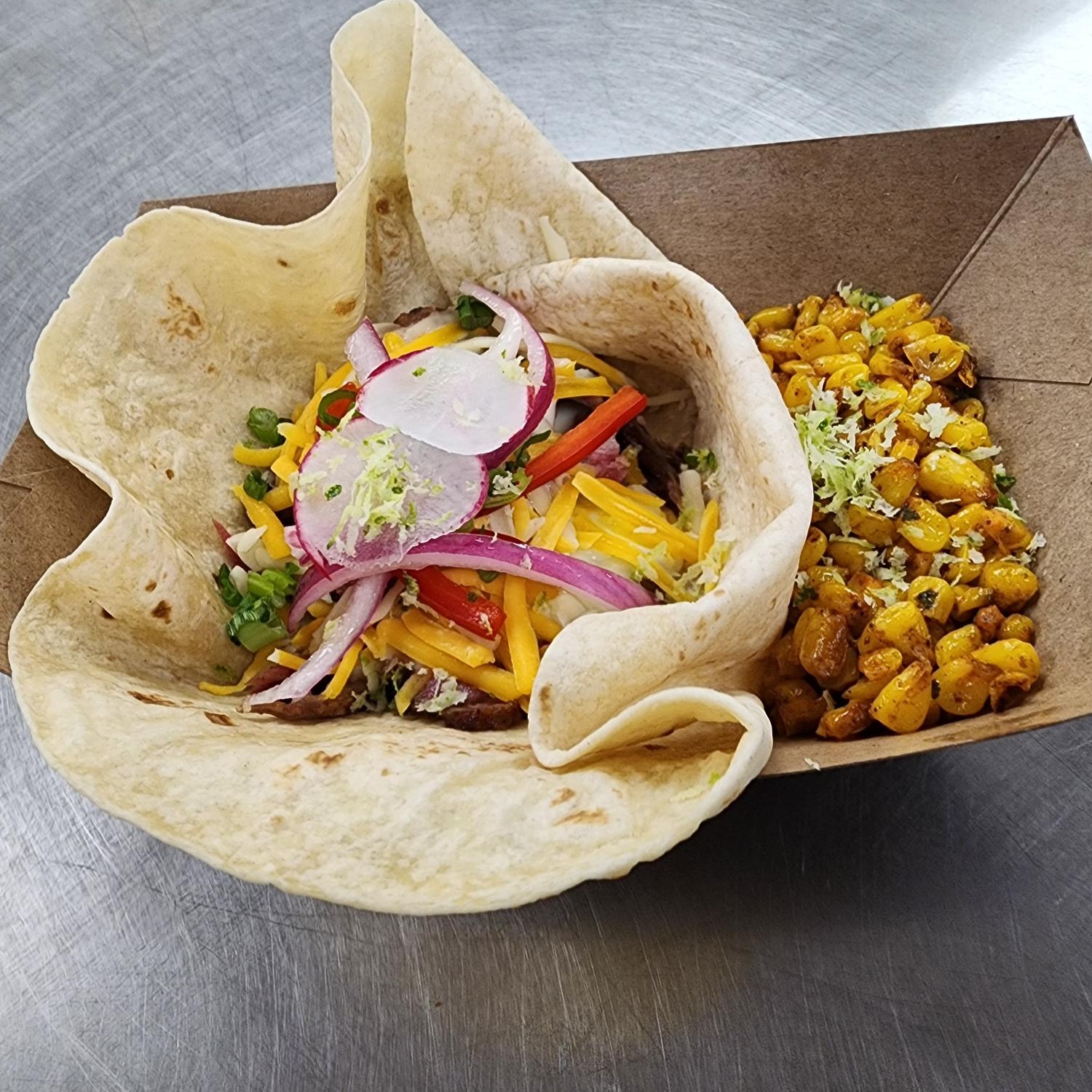 Taco with a side of corn