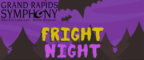 A lively performance by the Grand Rapids Symphony during their Fright Night event, featuring spooky decorations and costumes.