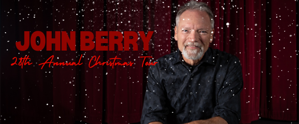John Berry performing during his Christmas tour, captivating the audience with festive music and holiday spirit.