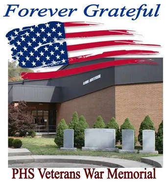 A memorial situated at the intersection of West and North Streets in the village of Phoenix, honoring local history.