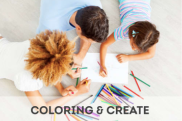 3 children lying on the floor coloring on the same paper coloring and create