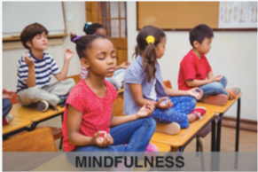5 children sitting on their desks in a meditation position mindfulness