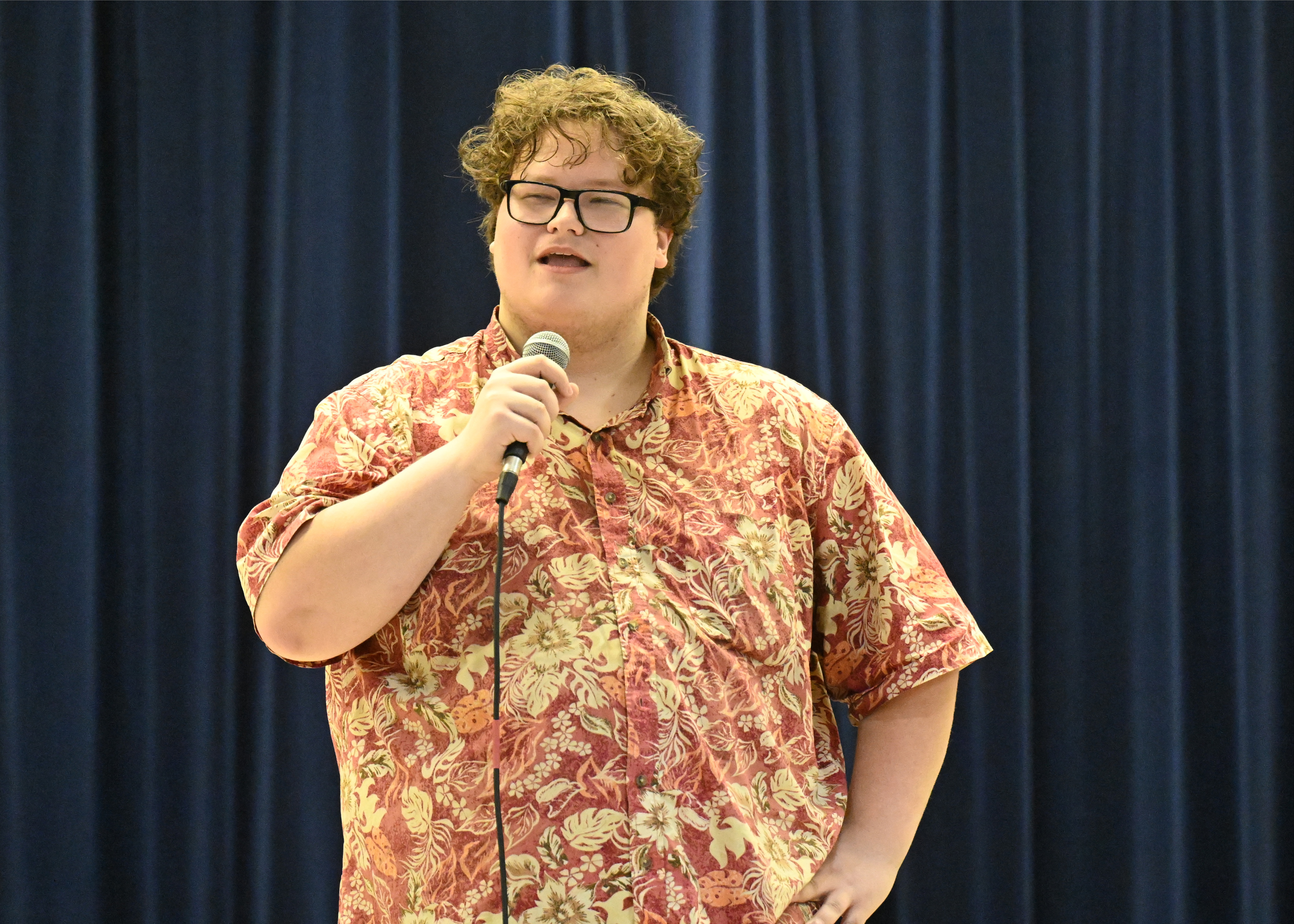 a guy talking into a microphone