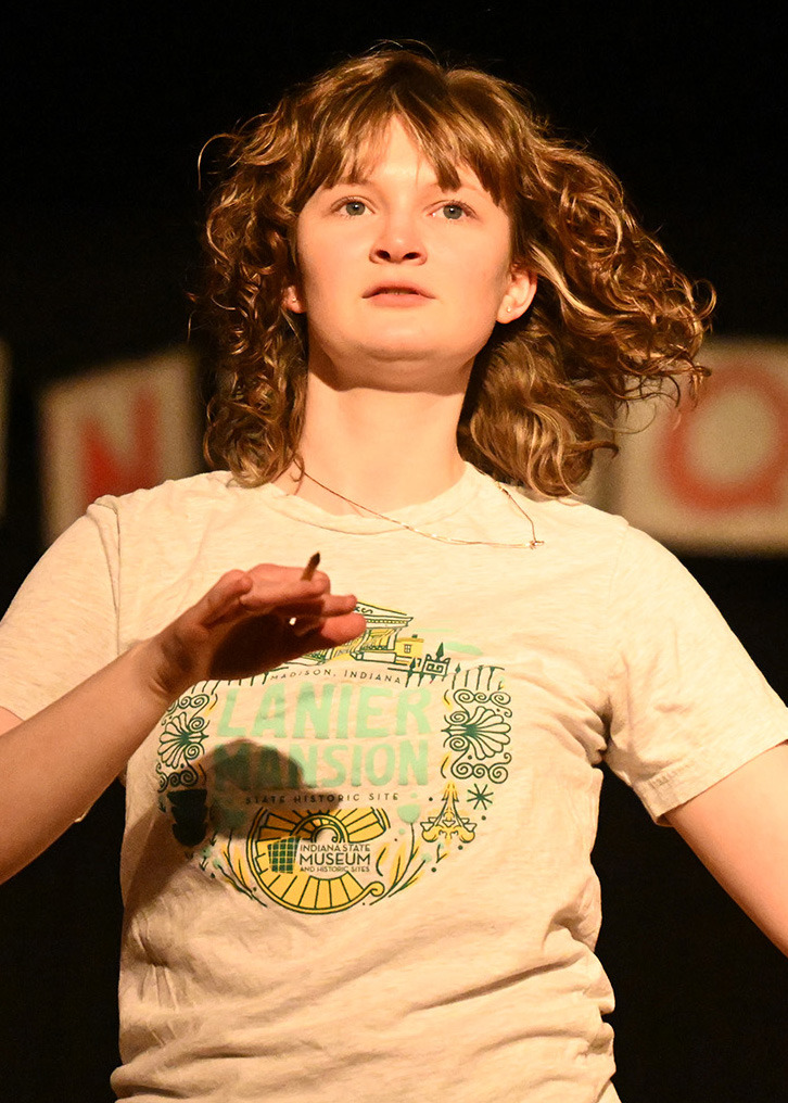 a woman dancing on a stage
