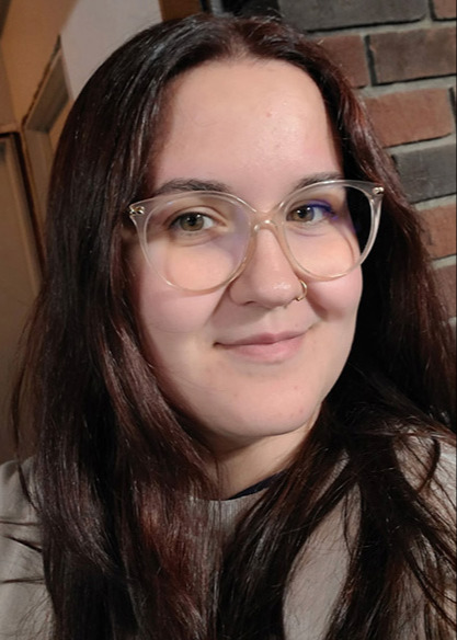 a girl posing with glasses on