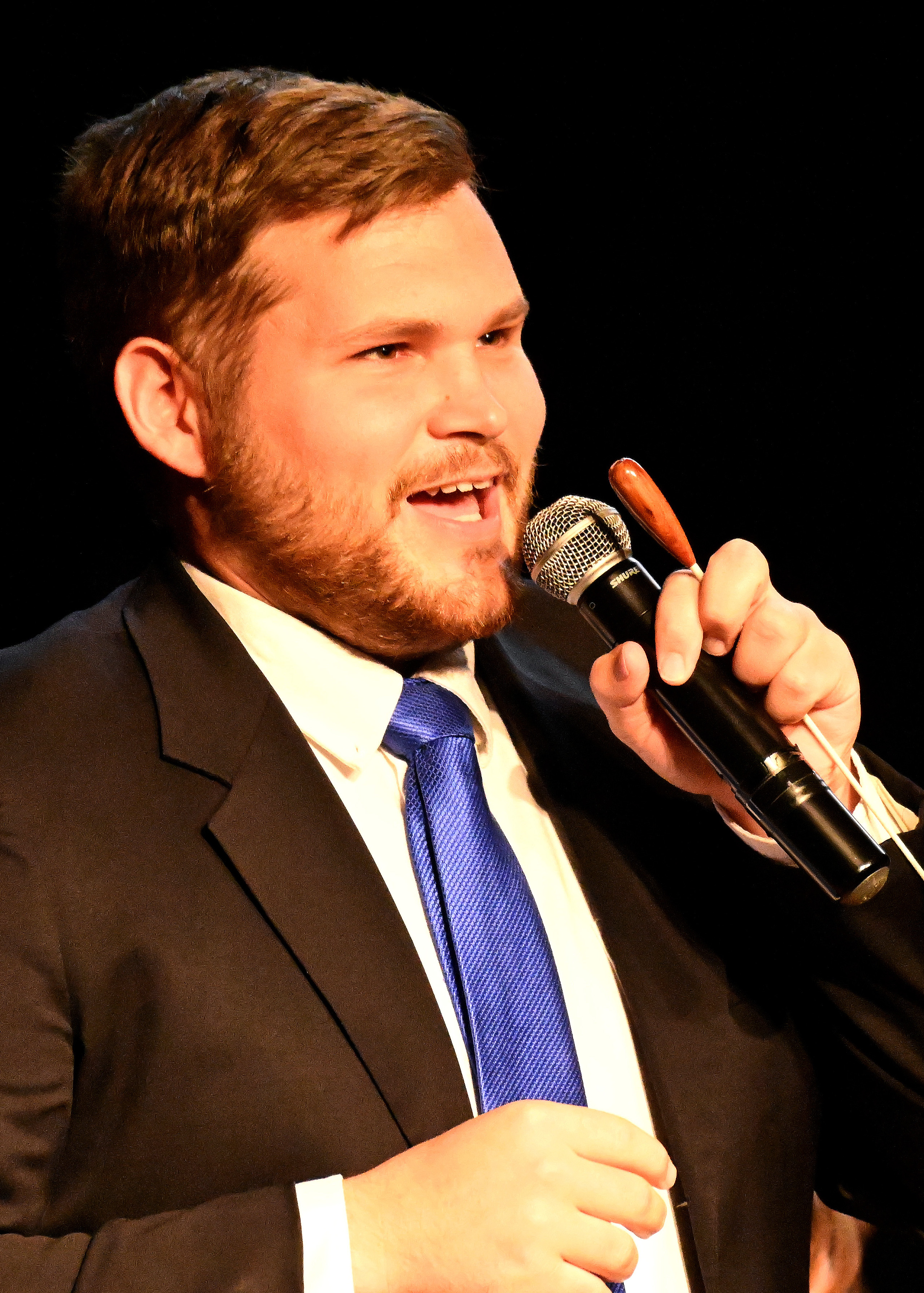 headshot of chris douglas talking into a microphone