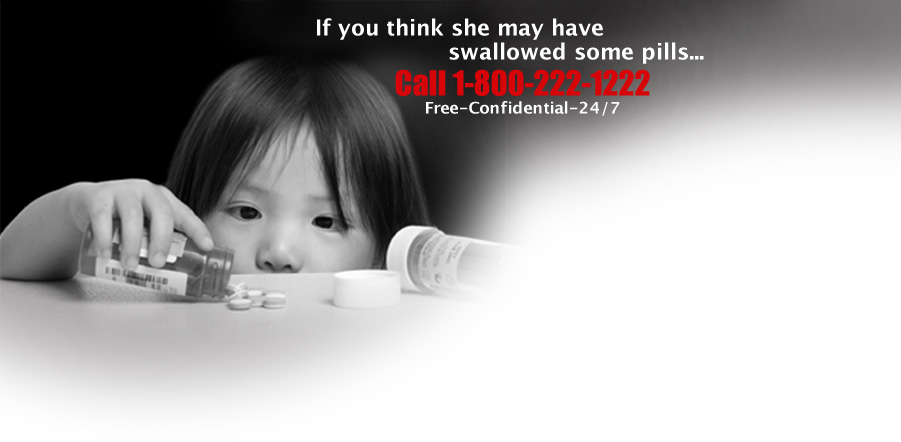 A child holds a pill bottle labeled with a message to call the poison control hotline if a problem is suspected.