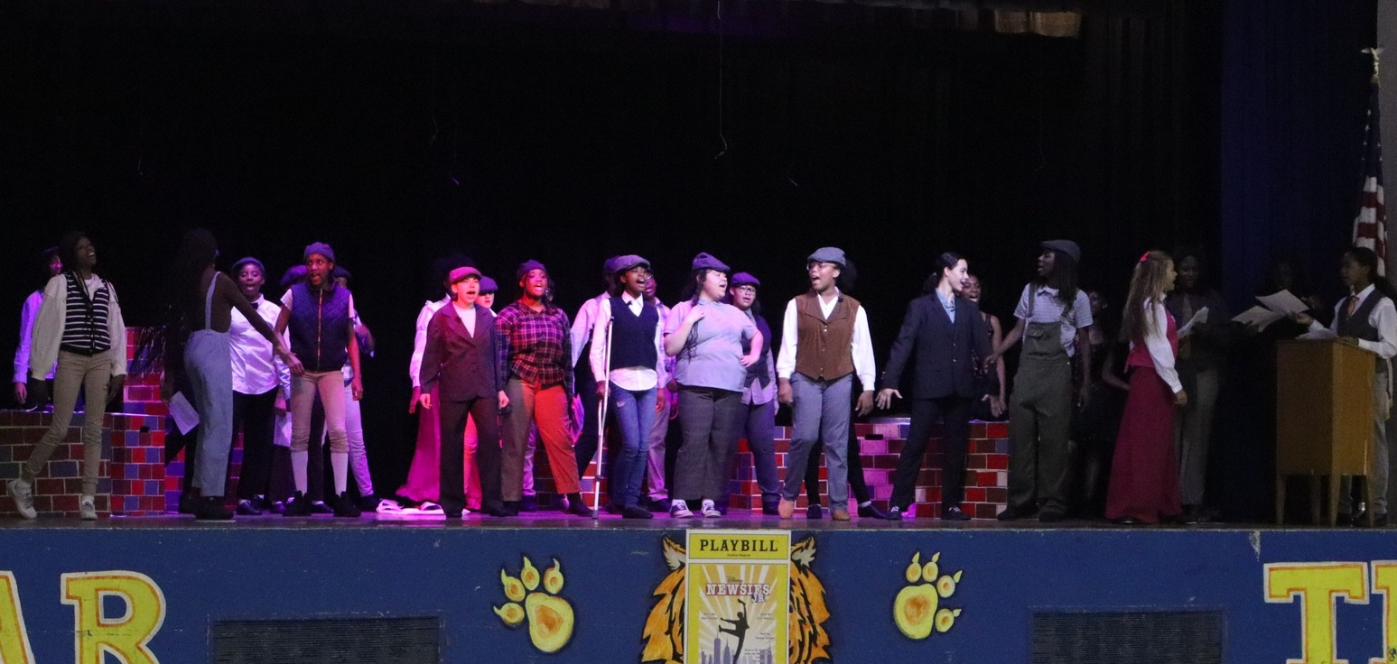 Dunbar theater students performing in Newsies