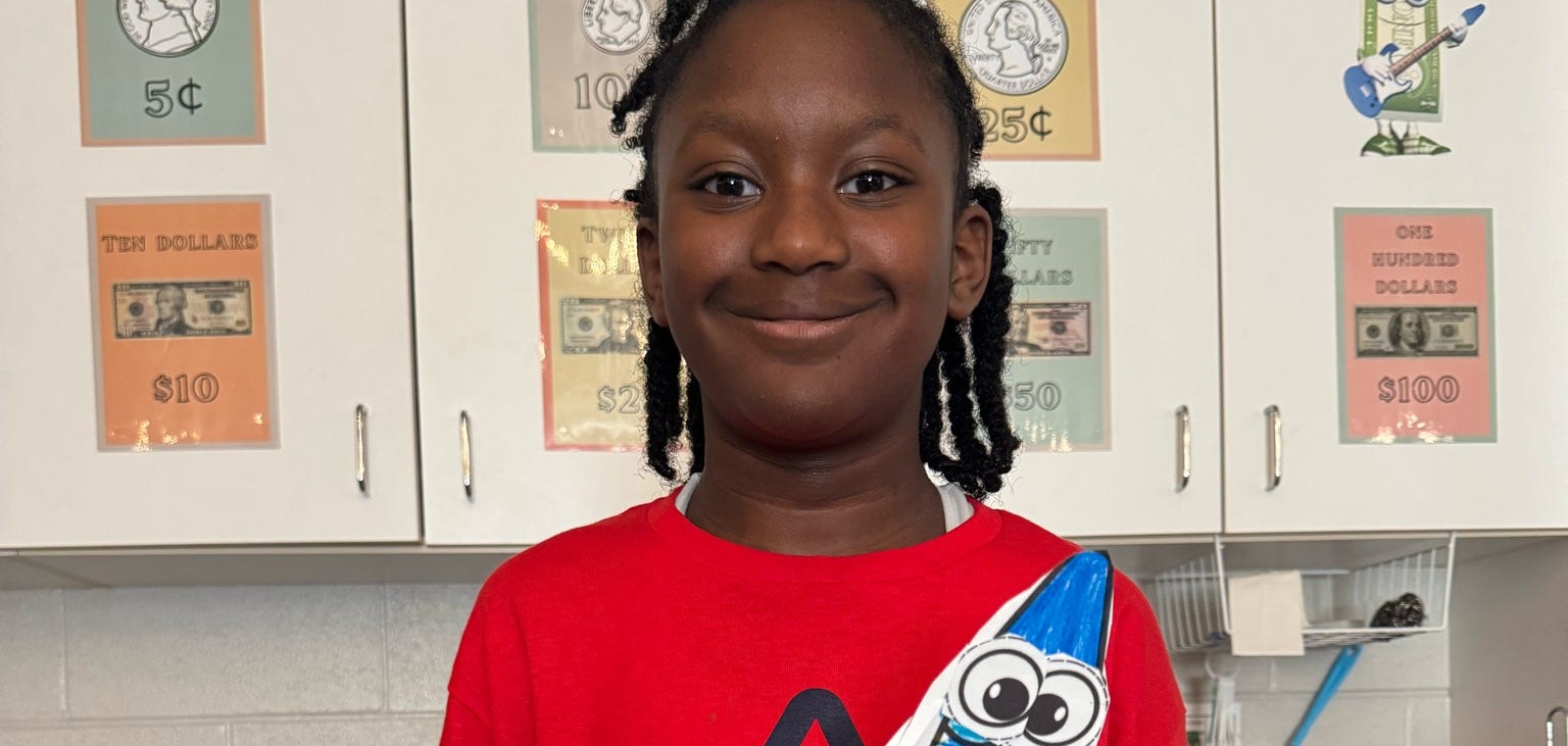 Student holding  her project
