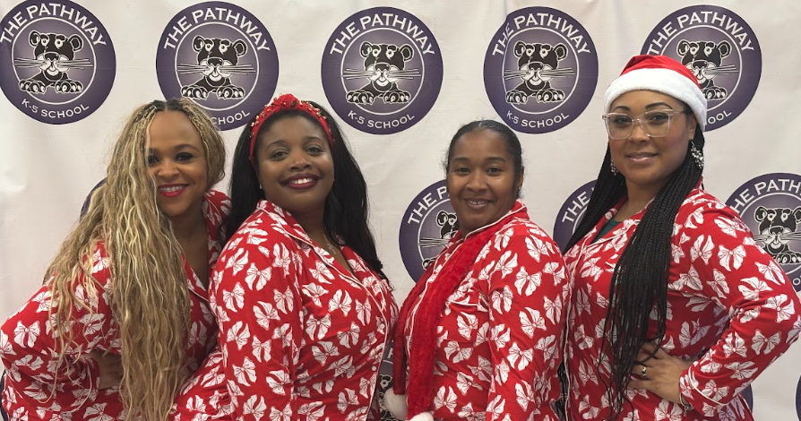 Teachers and staff dressed in their christmas pajamas