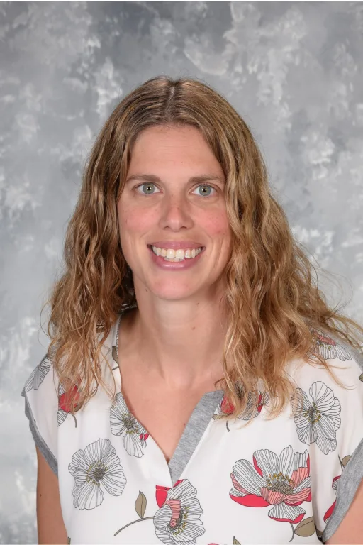 Corrie Roark School Photo- long blonde curly hair, Floral top