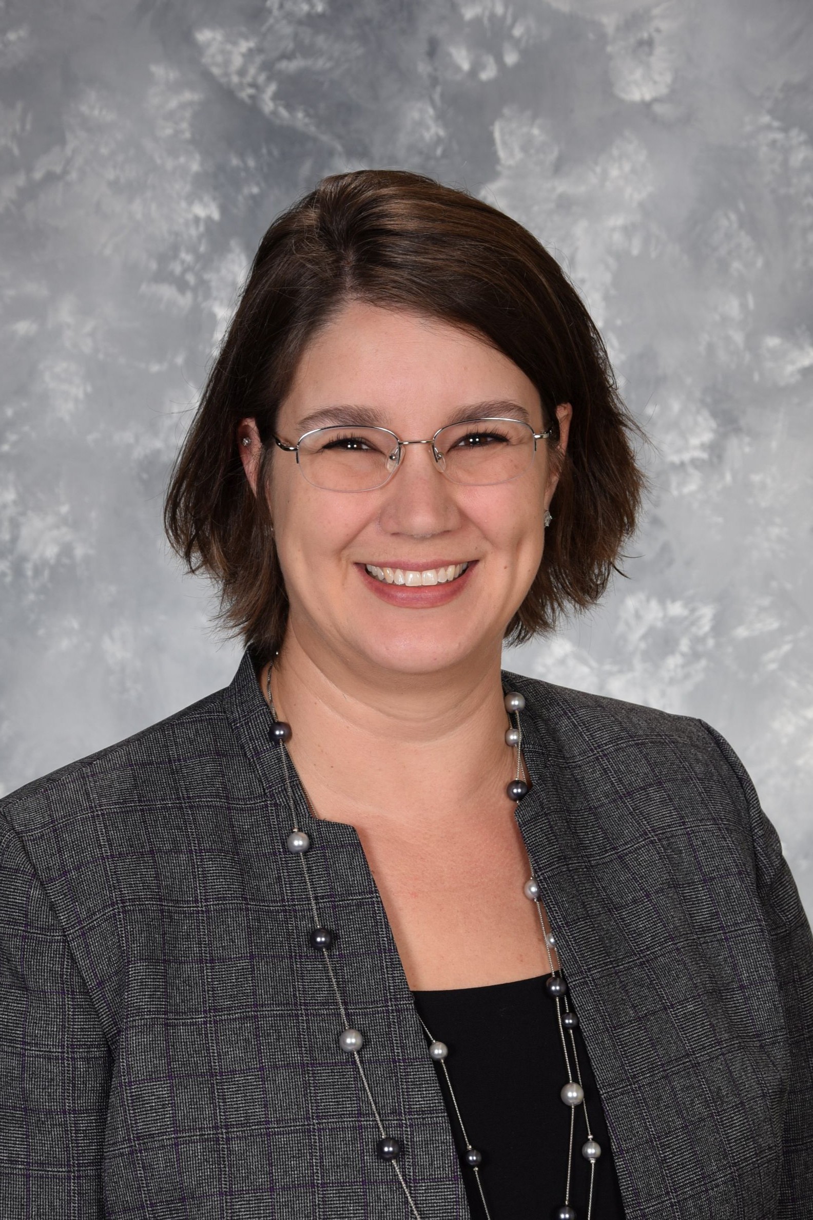 Sarah Walker School Photo - Brown hair, glasses, grey suit 