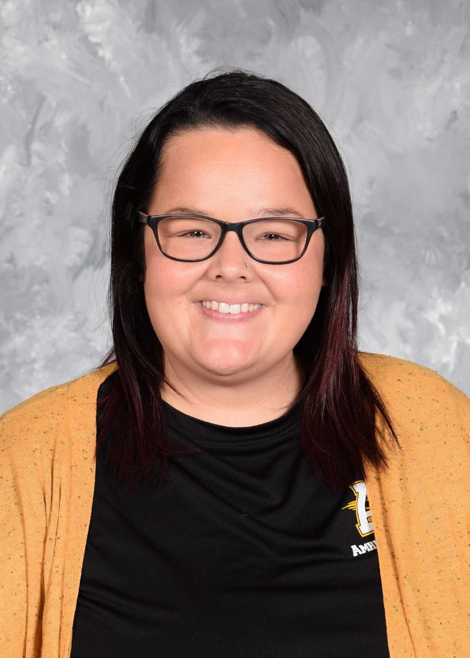 Rachel Mellen School Picture - Brown Hair, Black Shirt, Yellow Sweater