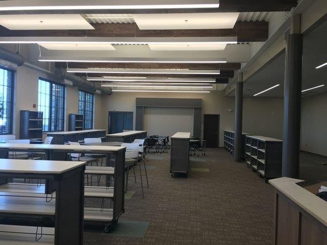 A modern library at the new high school, featuring spacious reading areas and contemporary design elements.