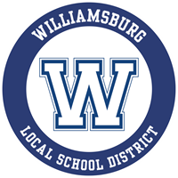Circular logo of Williamsburg Local School District featuring a large blue "W" on a white background with the district name around the border.