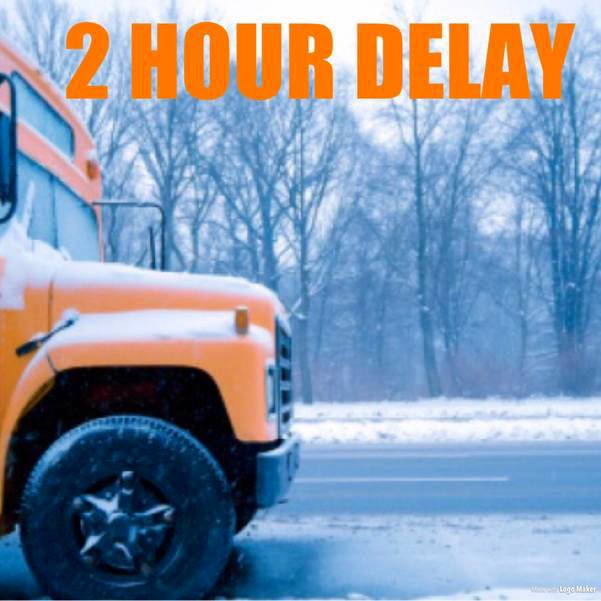 front end of school bus on a snowy road with the words 2 Hour Delay