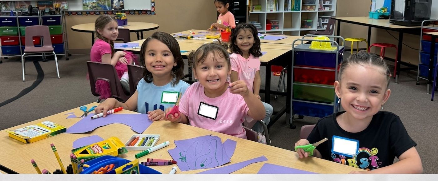 students smiling in the classroom