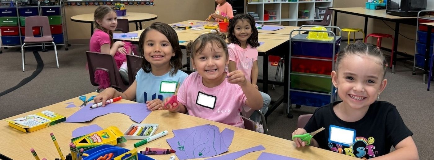 students smiling in classroom