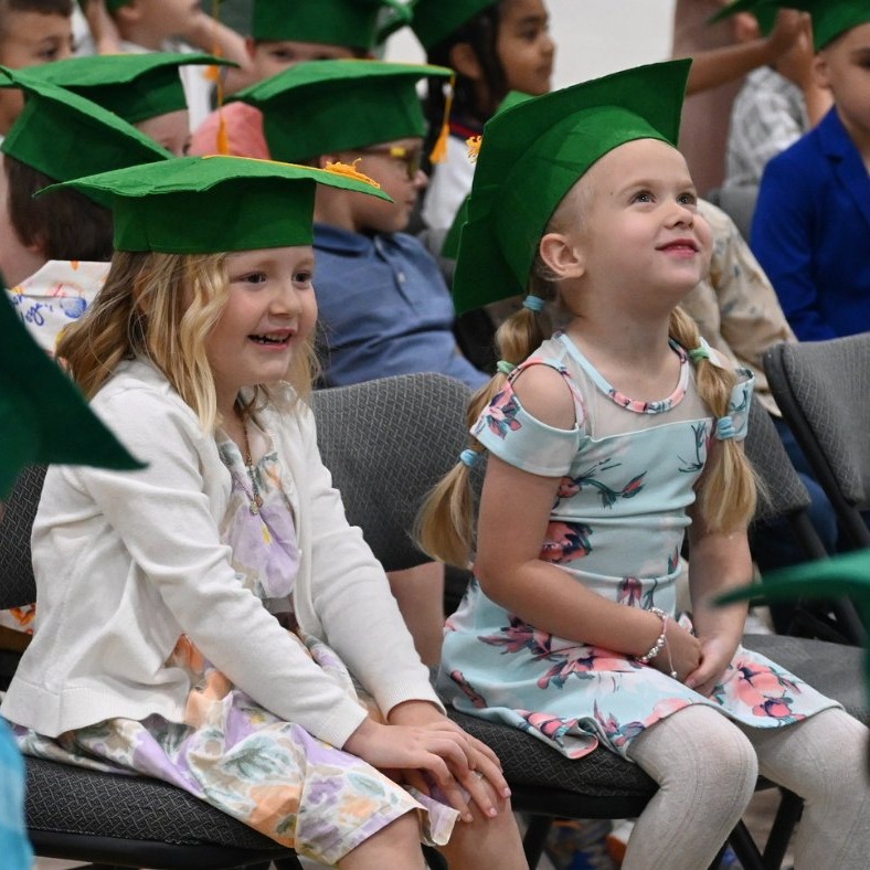 LCP Graduates with green grad caps