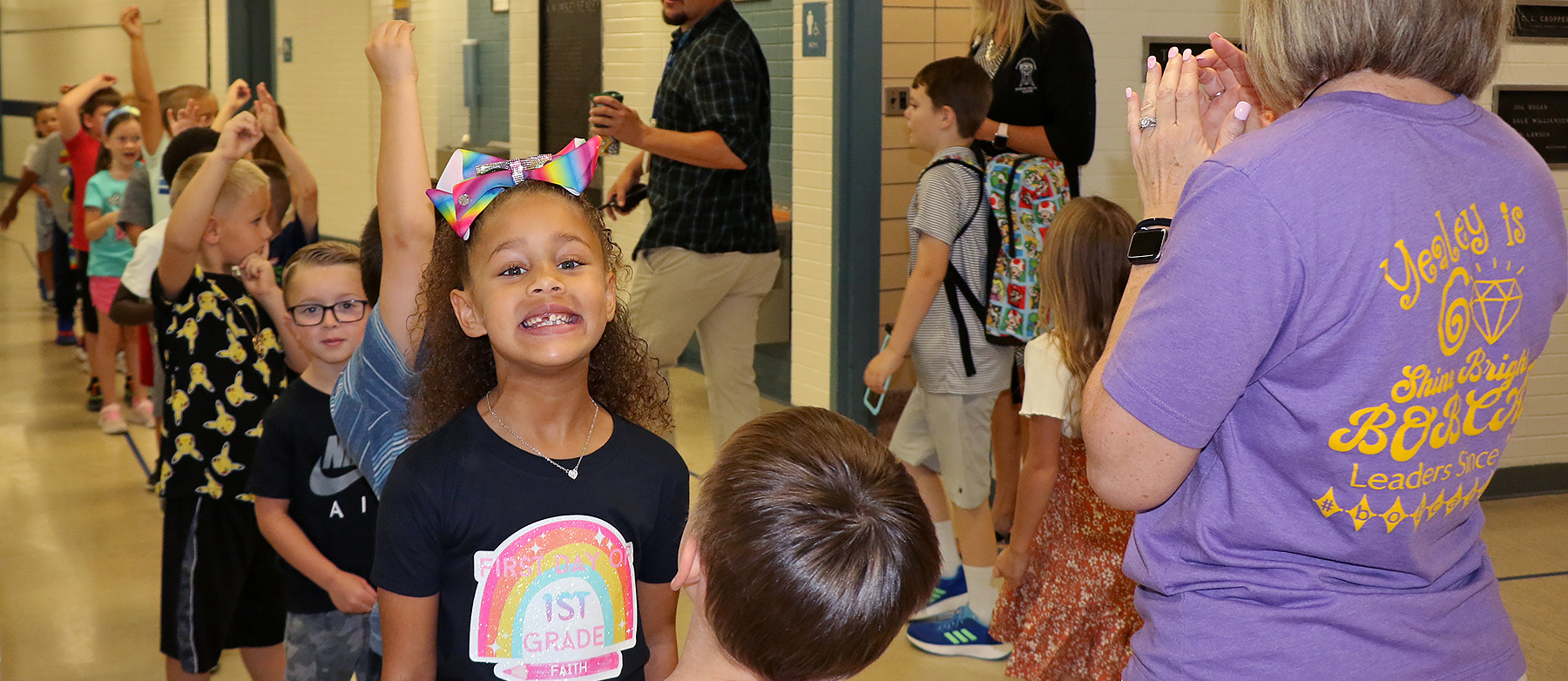 student smiling in hallway