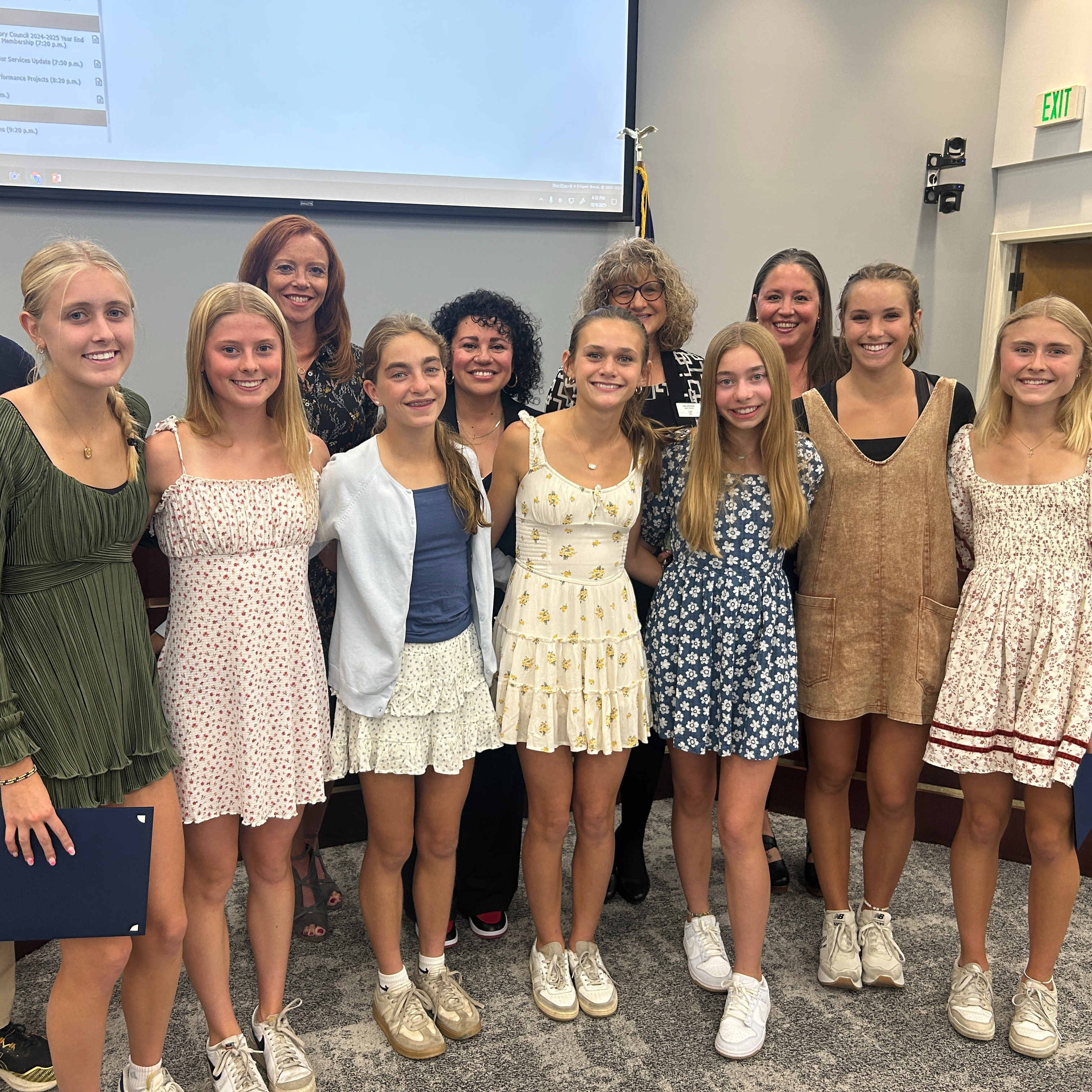 HHS girls cross country team with the Board of Education in the LPS Boardroom