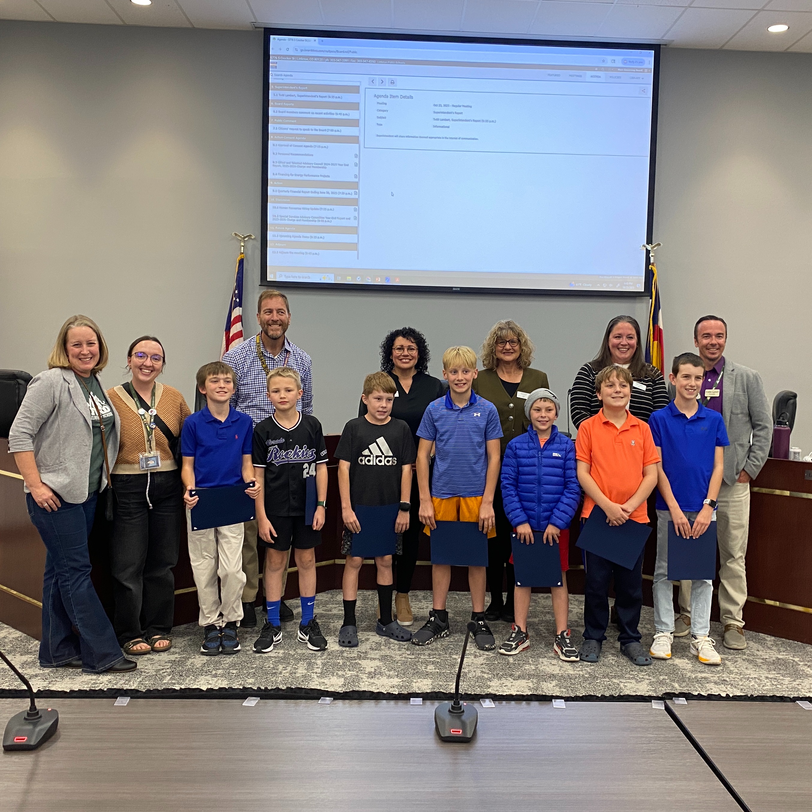Students and administrators from Ford Elementary stand with the Board of Education in the LPS Boardroom.